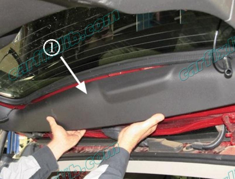 Remove the liftgate upper trim